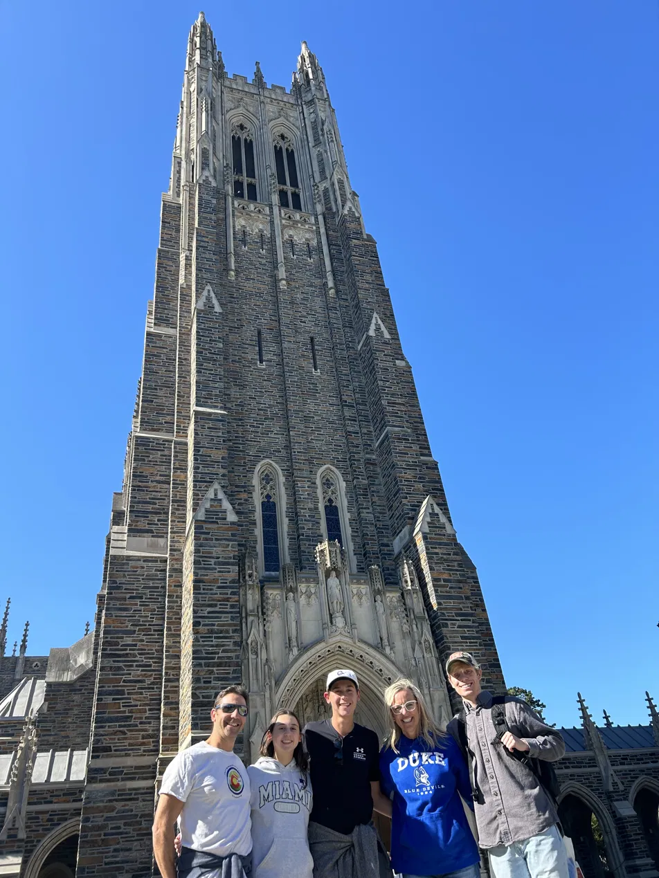 Family celebrating on a college campus visit